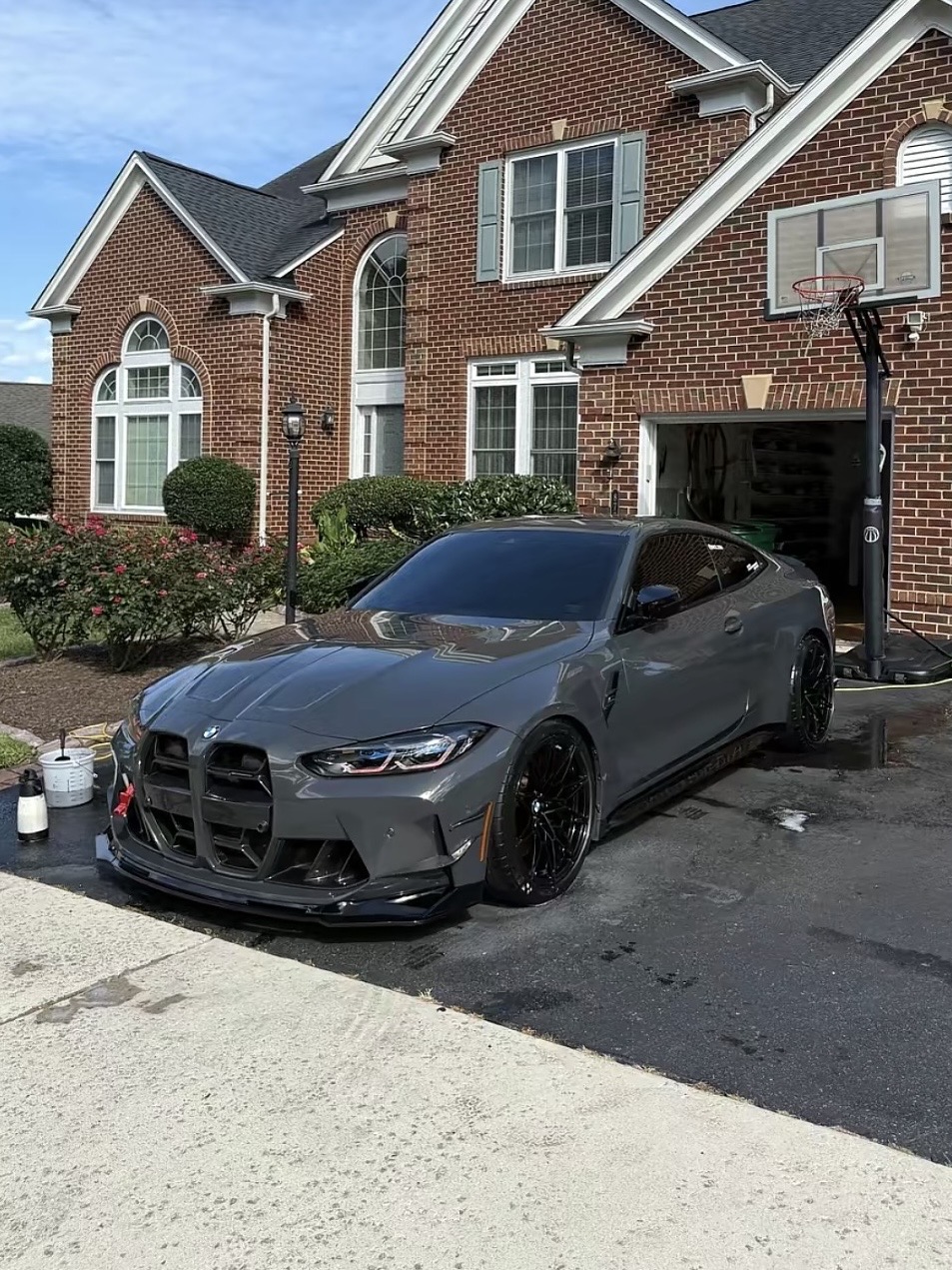 Gray sedan after detailing in a driveway
